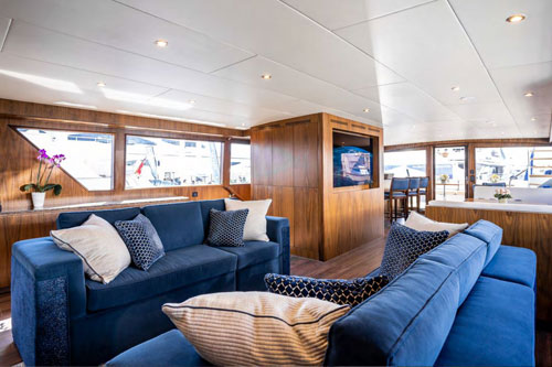 Motor Yacht A Place In The Sun salon area with sofas and bar